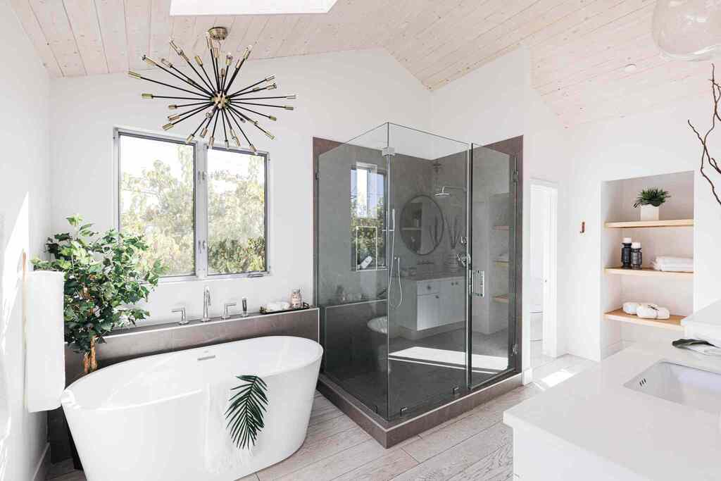 white bathtub and glass shower