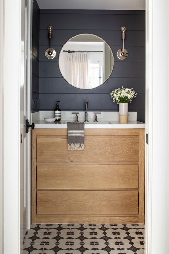 Wall paneling and contemporary vanity drawers in bathroom