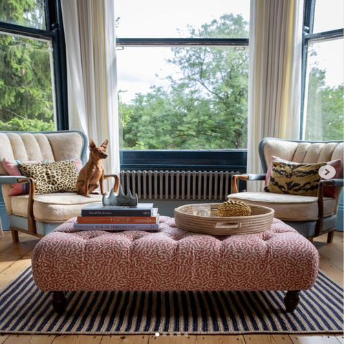 Ottomans around bay window