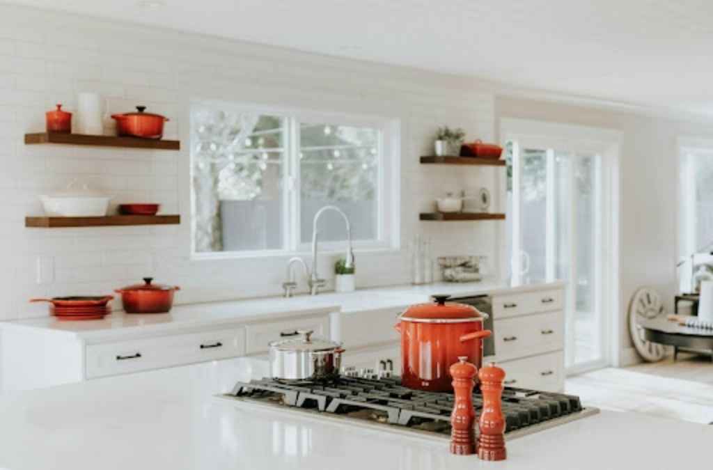 white kitchen with red accents